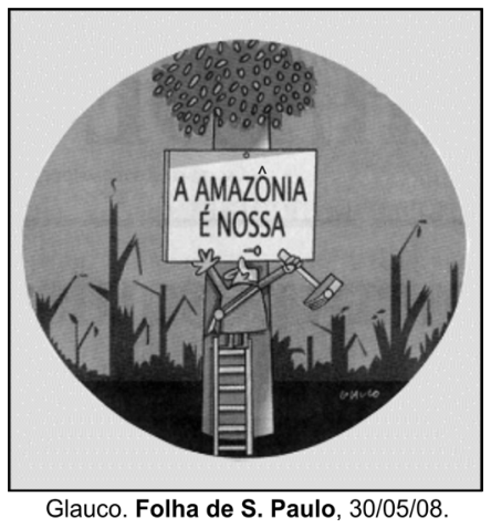 Charge de Glauco em formato circular: ao centro, um homem sobe em uma escada apoiada no tronco de uma árvore e usa um martelo para fixar uma placa com a frase "A AMAZÔNIA É NOSSA". Ao fundo, observa-se uma paisagem desolada com árvores desmatadas e galhos secos.