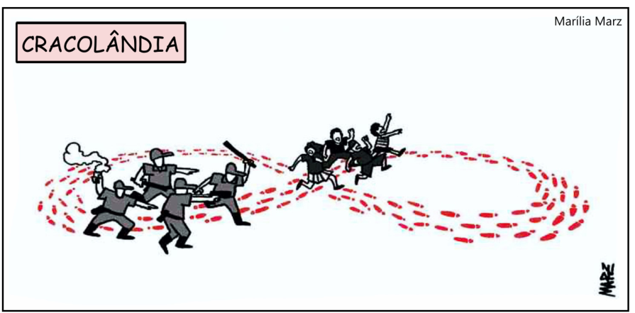 F1 Charge intitulada "CRACOLÂNDIA", de Marília Marz, mostrando policiais armados perseguindo pessoas ao longo de um trajeto circular de pegadas vermelhas no formato do símbolo do infinito.