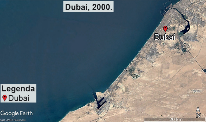 F1 Imagem de satélite do Google Earth mostrando o litoral de Dubai em 2000, com a linha de costa quase reta e apenas uma estrutura portuária artificial avançando sobre o mar.