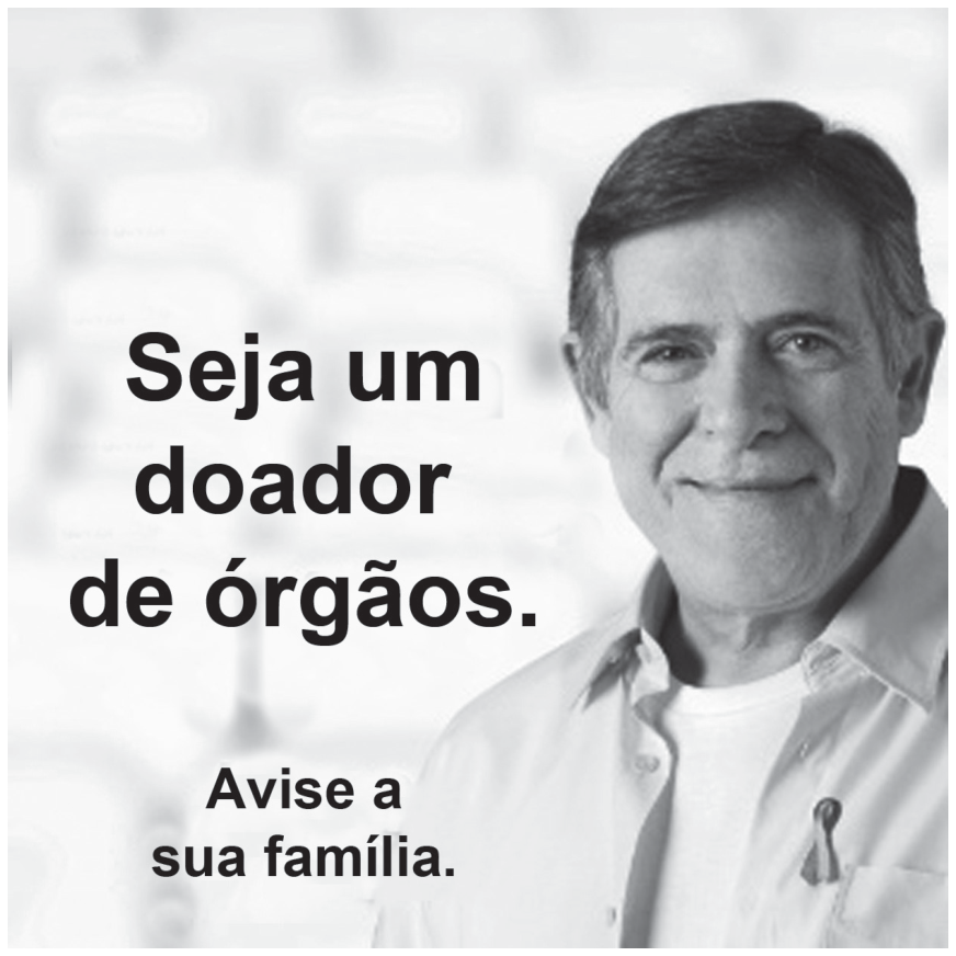Cartaz publicitário de campanha com a fotografia de um homem de meia-idade sorrindo, usando camisa clara com um laço preso no bolso. Ao lado esquerdo de sua face está o texto em destaque: "Seja um doador de órgãos." e abaixo: "Avise a sua família."