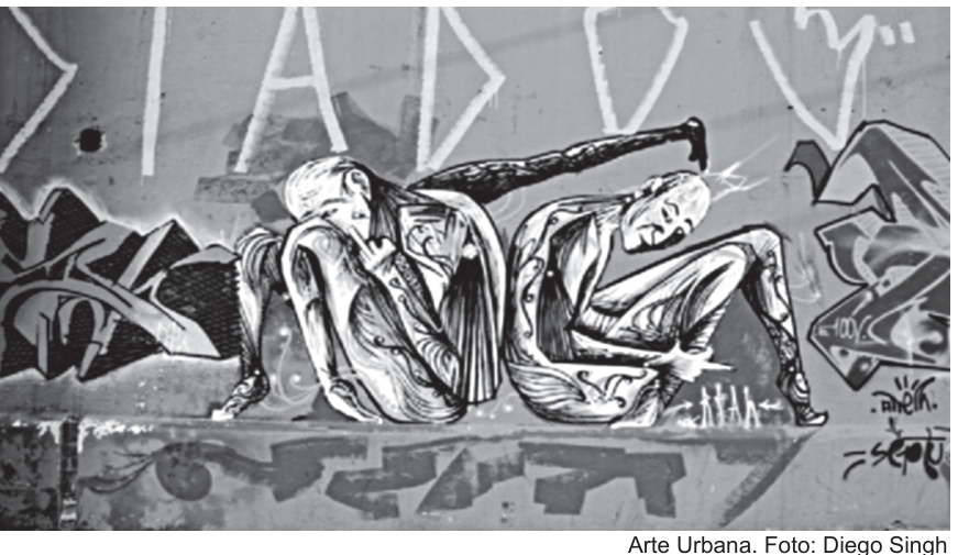 F2 Grafite contemporâneo em muro urbano com duas figuras humanas estilizadas sentadas de costas uma para a outra.