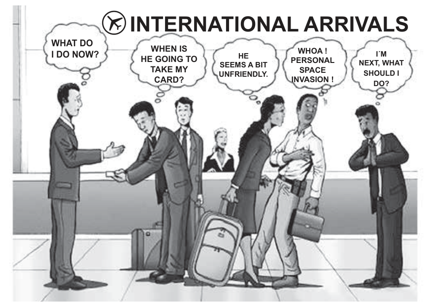 Cartum com o título "INTERNATIONAL ARRIVALS", mostrando pessoas em uma fila de aeroporto com balões de pensamento que indicam mal-entendidos culturais: um homem estendendo a mão enquanto o outro se curva oferecendo um cartão de visita ("WHAT DO I DO NOW?" e "WHEN IS HE GOING TO TAKE MY CARD?"); uma mulher se aproximando muito para falar com um homem que se afasta desconfortável ("HE SEEMS A BIT UNFRIENDLY." e "WHOA! PERSONAL SPACE INVASION!"); e outro homem aguardando com as mãos postas em saudação ("I'M NEXT, WHAT SHOULD I DO?").
