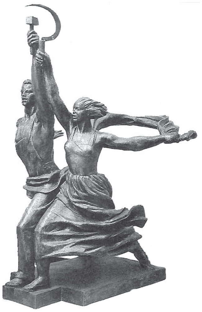 Escultura monumental "Operário e mulher kolkosiana", mostrando um homem e uma mulher em marcha resoluta para a frente, com os braços erguidos sustentando, respectivamente, um martelo e uma foice cruzados no alto.