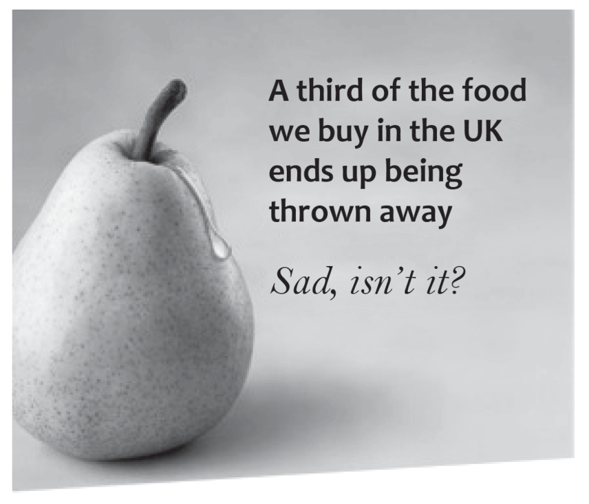 Cartaz de campanha publicitária mostrando uma pera que parece verter uma lágrima, acompanhada do texto em inglês: "A third of the food we buy in the UK ends up being thrown away. Sad, isn't it?"